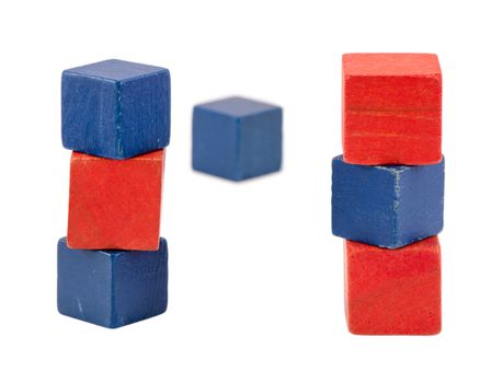 red blue color wooden toy log blocks bricks stand isolated on white.