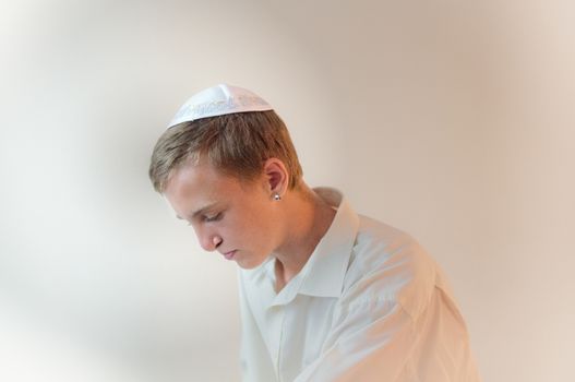 Young Jewish man does  prayers .