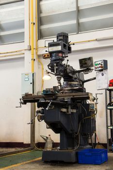 Shot of an old milling machine in a workshop.