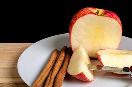 Cinnamon with Apple being sliced