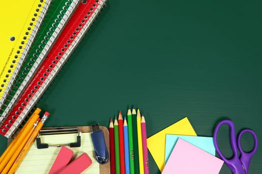 Miscellaneous Back to School Items on a Chalkboard Background