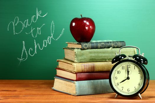 Back to School Books, Apple and Clock on Desk