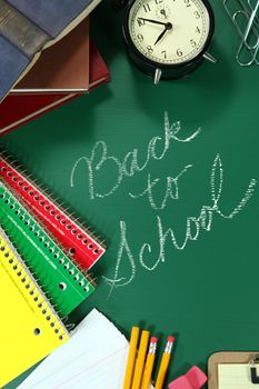Miscellaneous Back to School Items on a Chalkboard Background