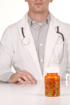 Handsome Doctor With Medication in Prescription Bottles