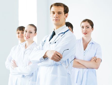 team of experienced highly qualified doctors, fold one's arms
