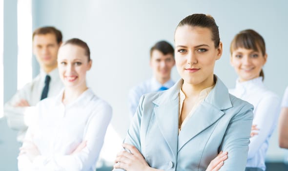 successful businessmen, a portrait of a business woman standing next to colleagues