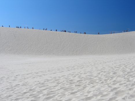 Africa people going on the dune full sunny day