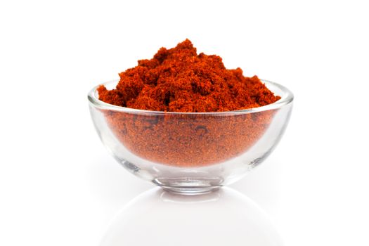 paprika spice in glass bowls, isolated on white background