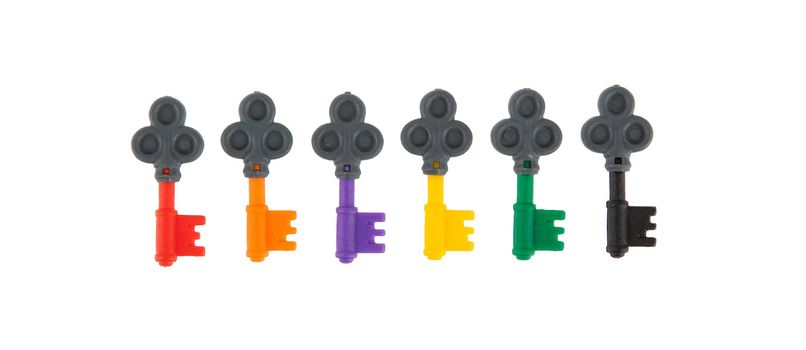 Six small keys, each with a different color, isolated on white