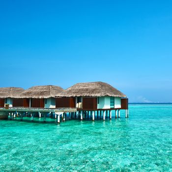 Beautiful beach with water bungalows at Maldives