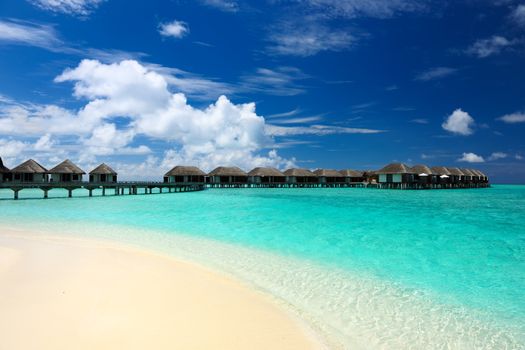 Beautiful beach with water bungalows at Maldives