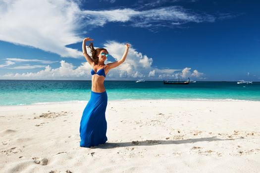 Woman in skirt at tropical beach