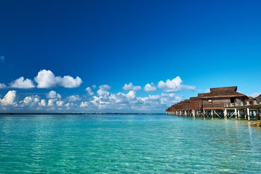 Beautiful beach with water bungalows at Maldives