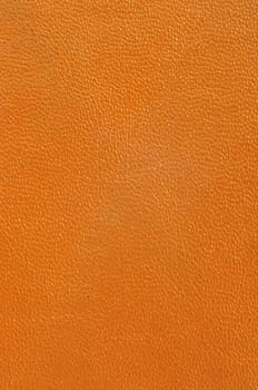 Close up texture of brown or orange leather for use as Background
