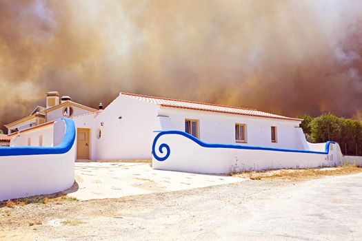 Huge forest fire threatens home in Portugal