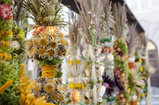 traditional spring easter decor handmade floral palm sale in outdoor street fair market.