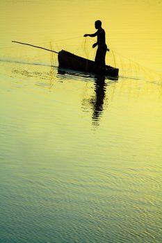 Dramatic sunset of a Traditional Fisherman Sillhouette