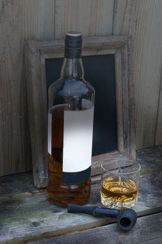still life with whisky and a pipe
