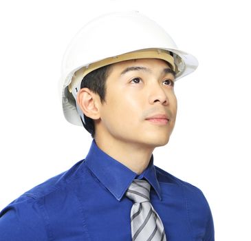 Close-up of a man wearing a hardhat and looking up