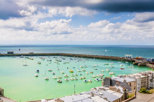 View of the port of Granville with houses, boats, harbor wall and wharf, Upper Normandy, France