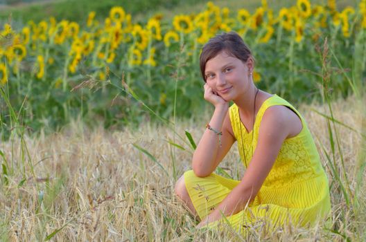 beautiful girl on fiel with background of sunflower
