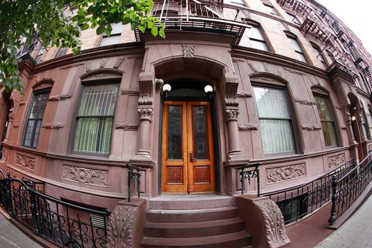 Limestone Building Steps leading to wood door entrance Manhattan New York