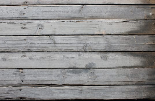 Old gray planks with nails. wood texture background