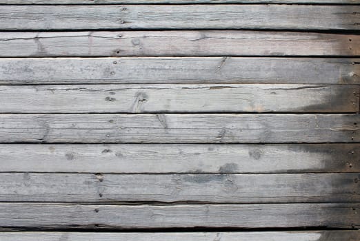 Old gray planks with nails. wood texture background