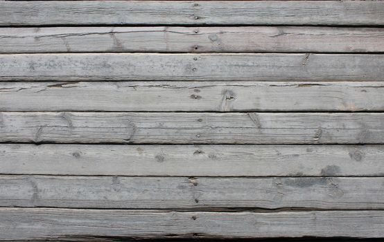 Old gray planks with nails. wood texture background