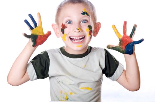 Boy with hands painted in colorful paints ready for hand prints isolated