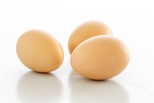 Three eggs isolated over a white background. 