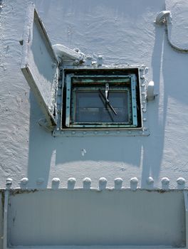 An open hatch exposing the glass window and wiper on a retired military ship at the Buffalo and Erie County Naval and Military Park, Buffalo, NY, USA