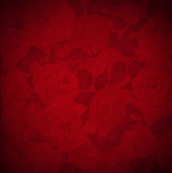 Closeup detail of aged red velvet texture background with roses flowers