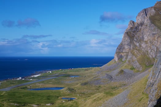 Scenic norwegian coastal cliffs on island Vaeroy, Lofoten