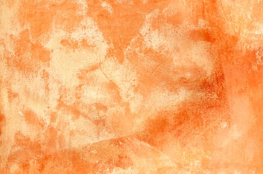 Rough, old plastered wall in brick orange