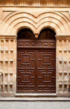 Wooden door of the convent of Holy Trinity (convent de la Trinidad) in Salamanca, Spain