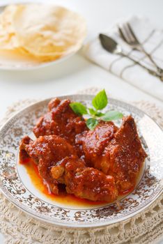 Indian curry chicken. Popular Indian dish on dining table.