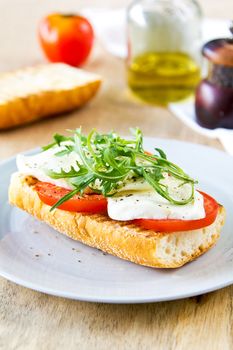 Mozzarella with tomato and rocket sandwich