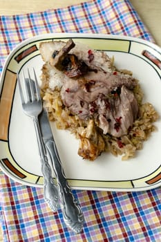 Pork knuckle with sauerkraut and mushroom sauce