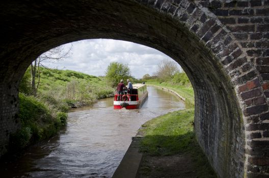 Narrow boat sailing on the canal