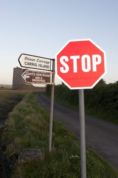 stop sign at a junction near Carrigafoyle castle in county Kerry, Ireland