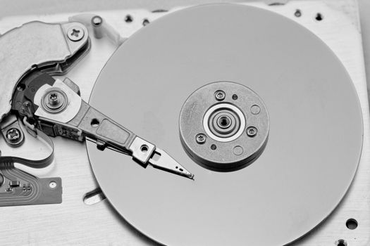 Open computer hard drive on white background in bw color (HDD, Winchester)