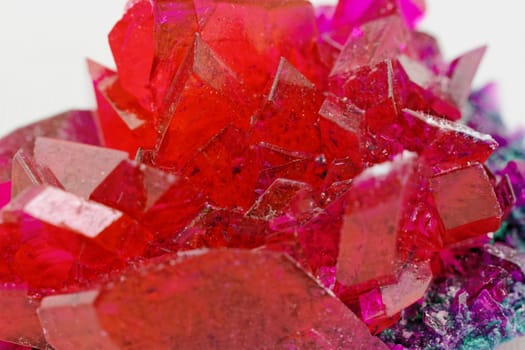 close up of crystals in ruby color on white background (red crystal)