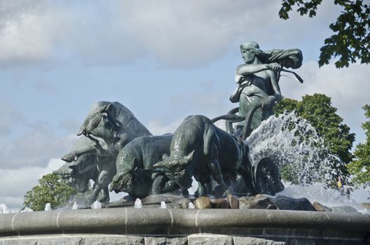 The Gefion Fountain is a large fountain on the harbour front in Copenhagen, Denmark. It features a large-scale group of bulls being driven by the legendary Norse goddess, Gefjun