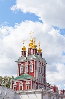 Tower of the Novodevichy Convent in Moscow on a background of blue sky