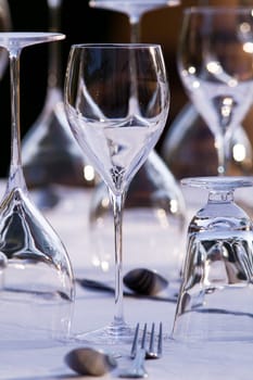 Beautifull restaurant setting of glasses and cutlery on a table