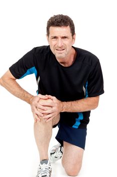 adult attractive man in sportswear knee pain injury ache isolated on white