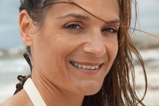 attractive smiling adult woman outside in summer portrait