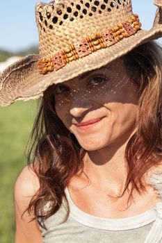 attractive smiling adult woman outside in summer portrait