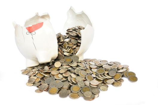 Pink piggy bank broken with money isolated on white background